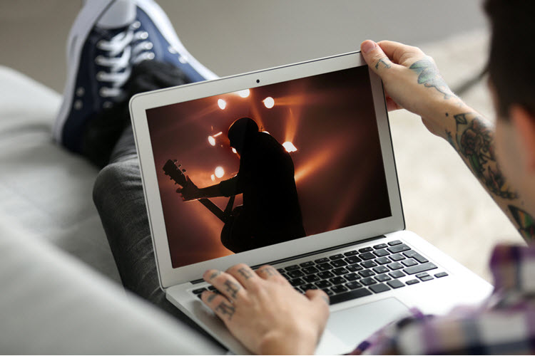 person streaming concert - shutterstock_446166040